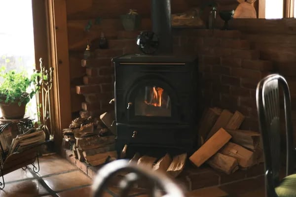 The Warmth Revolution: Rediscovering the Power of Wood Burning Stoves Cover